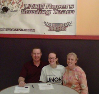 Raelyn poses with Coach Book and her Mother