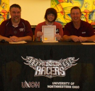 Justin Starn holds his signed Letter of Intent after committing to bowl for UNOH