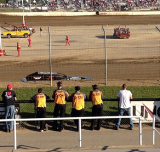 Members of the UNOH Motorsports Team gather at the fence during hot laps Friday night at Limaland Motorsports Park