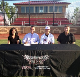 Randal Muhlenkamp is joined by his parents and UNOH coach Kory Hartman after signing his Letter of Intent at Racers Field